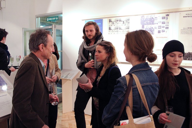 Richard Hollis talks to exhibition visitors. Photo: Alice Masters 