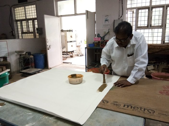 Ramesh Hengadi preparing a canvas at the Indian Institute of Craft and Design, Jaipur  
