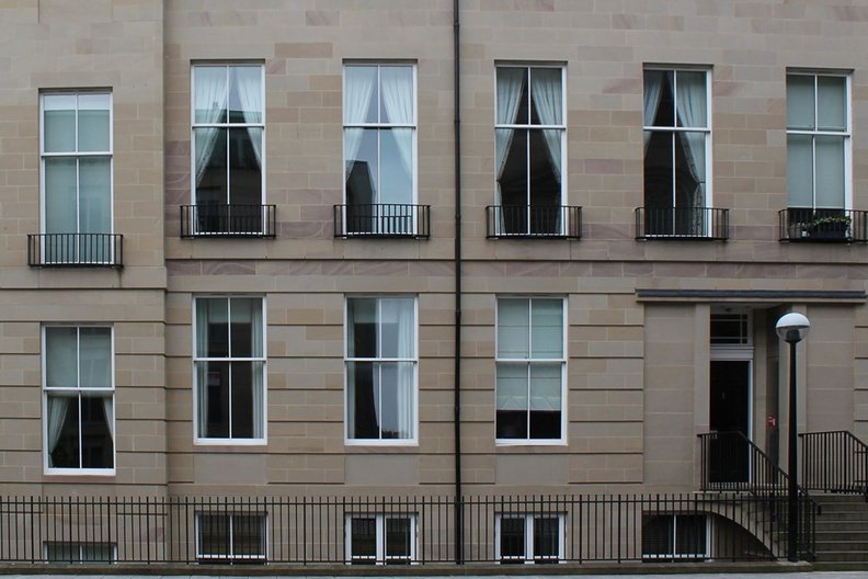 Large sliding windows, St Vincent Place, Edinburgh; not cleanable as per requirements of BS8213. Photograph by Liam Ross  